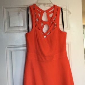 Coral Cocktail dress with cut away details
